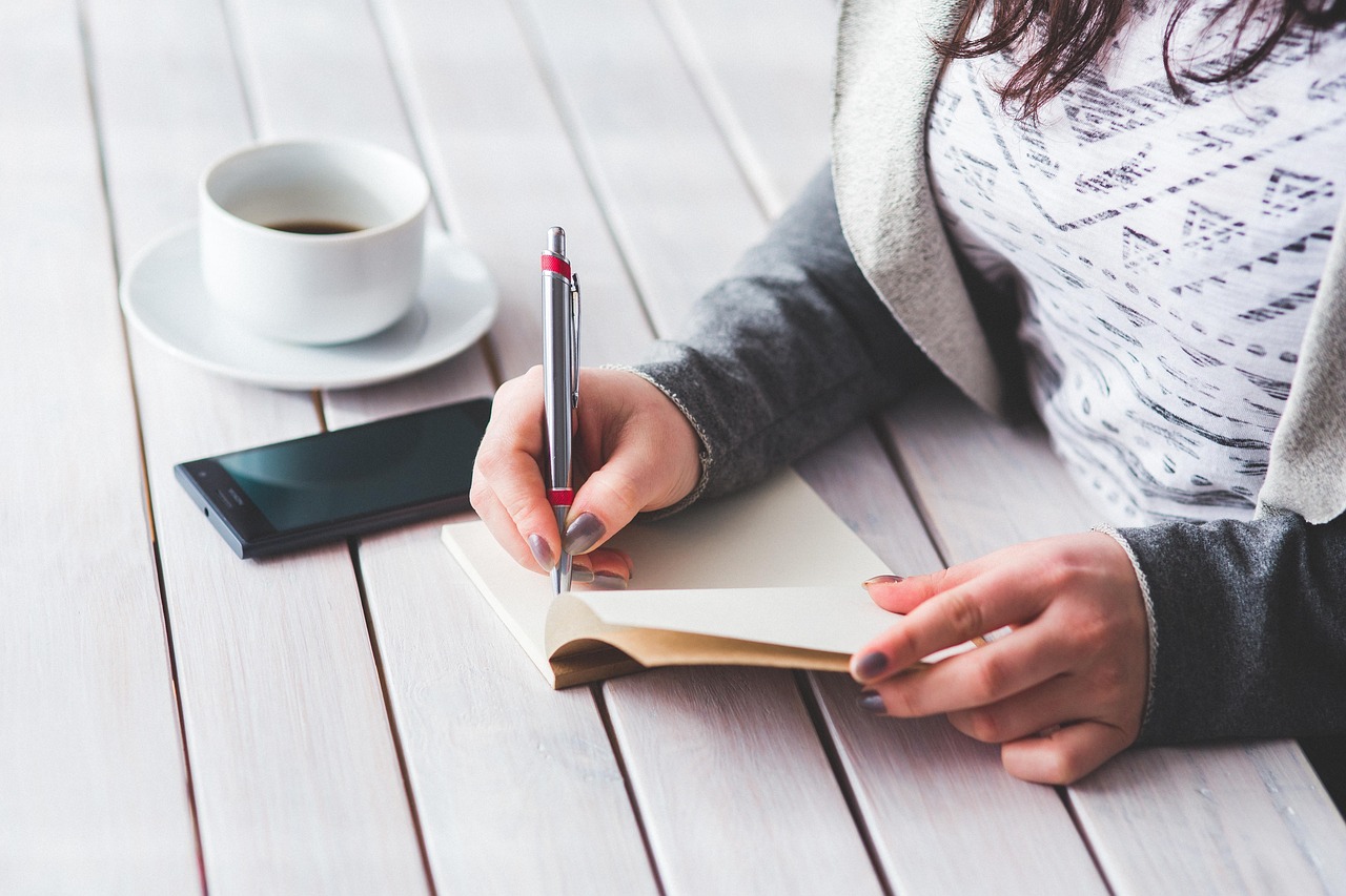 Woman, write, notepad — Experience the Transformation with Lip Blushing in Atlanta