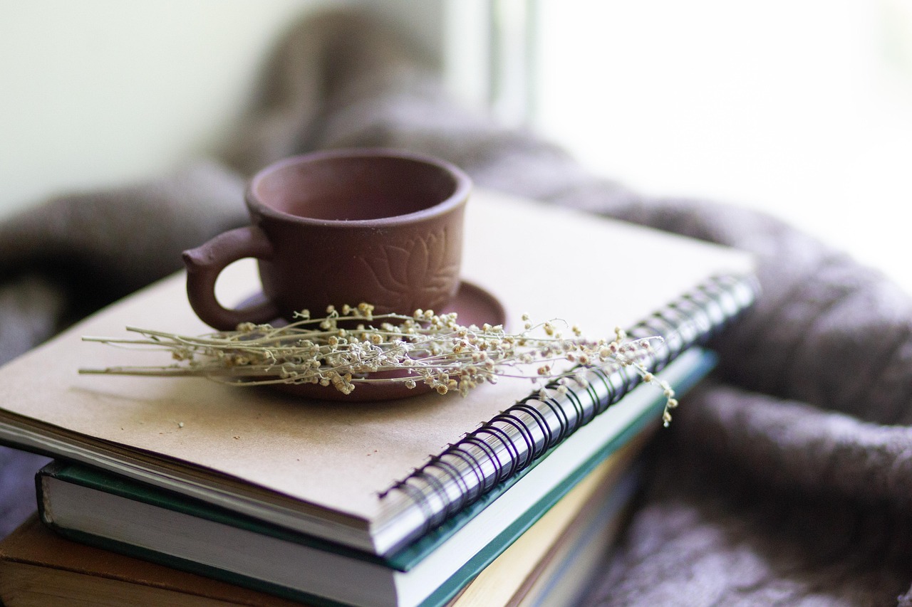 Books, cup, herbs — PCA Certification Online Offers Convenient Training for Aspiring Care Professionals