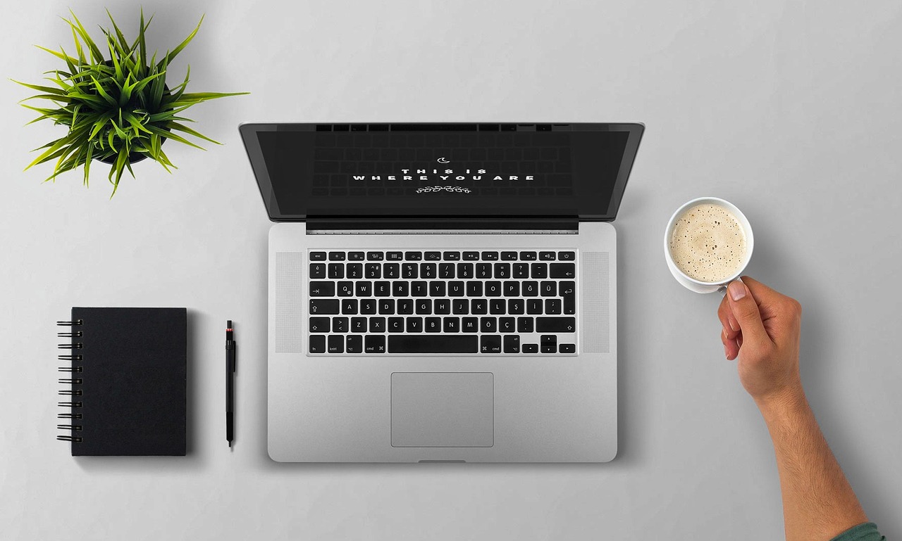 Laptop, coffee, arm — Understanding the Different Types of White Label SEO Services
